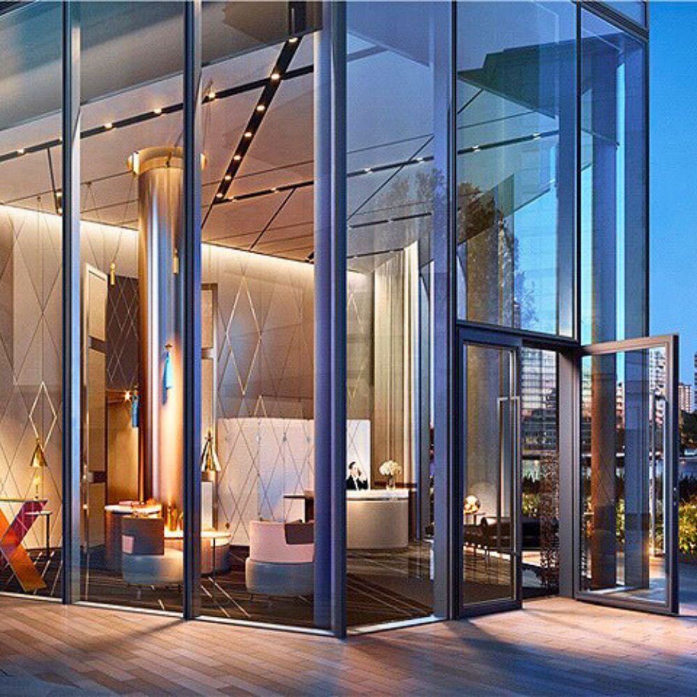Wide-angle view of Chelsea Waterfront lobby showcasing modern architectural design and lighting.