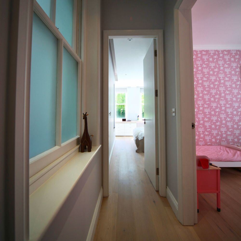 Connecting hallway offering access to children's room and main bedroom.