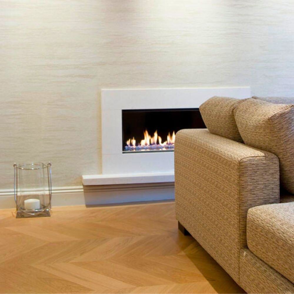 Minimalist fireplace design in a neutral-toned space with herringbone flooring.